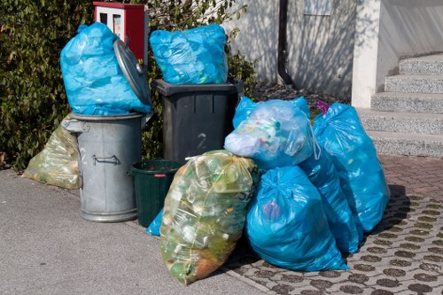 Workers wearing PPE while sorting commercial waste material